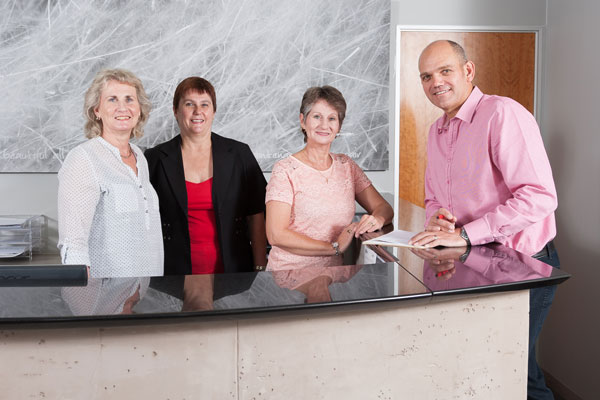 Dr Adriaan Smit with the UpperLimb office team